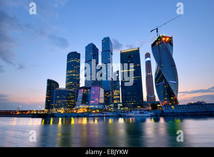 View of skyscrapers on Moskva river at night, Moscow, Russia Stock Photo