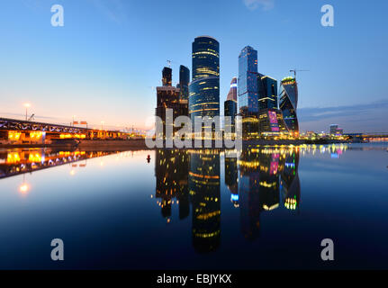 View of skyscrapers on Moskva river waterfront at night, Moscow, Russia Stock Photo