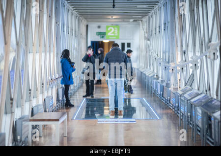 London, UK. 2nd December, 2014. people visit the new glass floor in Tower Bridge. One of the bridge’s new £1 million glass-bottomed walkways, that was cracked last week when a visitor dropped a beer bottle, has now been replaced. Credit:  Piero Cruciatti/Alamy Live News Stock Photo