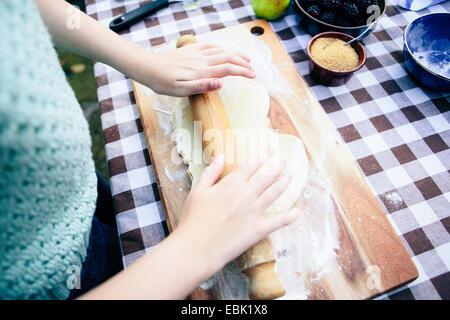 Girl rolling pastry Stock Photo