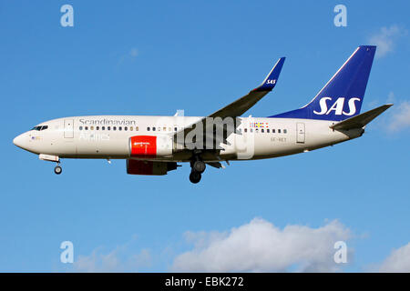 Scandinavian Airlines (SAS) Boeing 737-700 approaches runway 27L at London Heathrow airport. Stock Photo