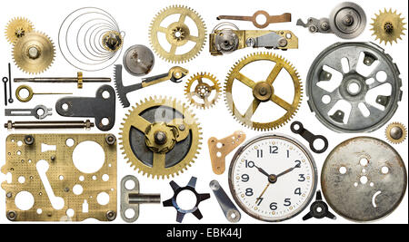 Clockwork spare parts. Metal gear, cogwheels, dial. Stock Photo