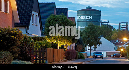 panoramic view through a residential street with at the heritage-protected smelting furnace plant of the former steel mill Phoenix West and the gasometer at the district Hoerde, Germany, North Rhine-Westphalia, Ruhr Area, Dortmund Stock Photo