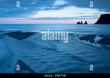 glacial outflow into sea at dusk, Iceland, Reynisdrangar, Vik Stock Photo
