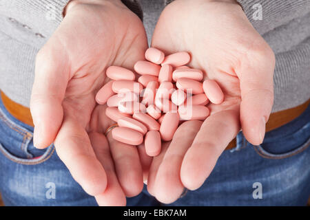 many pills in the hands. medicine concept Stock Photo