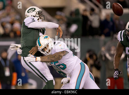 Dec. 2, 2014 - East Rutherford, Florida, U.S. - Miami Dolphins outside linebacker Koa Misi (55) pressures New York Jets quarterback Geno Smith (7) in the fourth quarter at MetLife Stadium in East Rutherford, New Jersey on December 1, 2014. (Credit Image: © Allen Eyestone/The Palm Beach Post/ZUMA Wire) Stock Photo