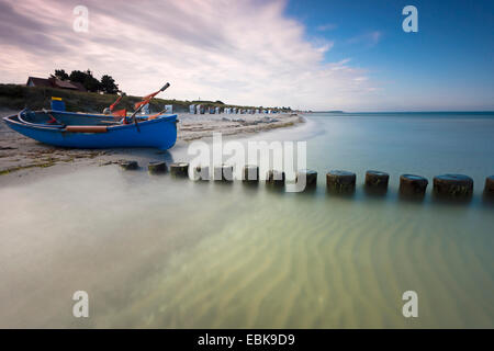 fishing boat and spur dike at Baltic Sea in morning light, longtime exposure, Germany, Mecklenburg-Western Pomerania, Hiddensee, Dornbusch Stock Photo