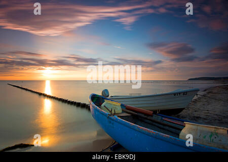 fishing boat and spur dike at Baltic Sea in evening light, longtime exposure, Germany, Mecklenburg-Western Pomerania, Hiddensee, Dornbusch Stock Photo