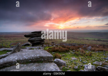 Stormy sunset at the Cheesewring on Bodmin Moor in Cornwall Stock Photo