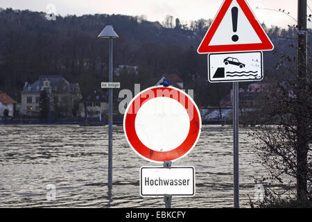 high water of Weser river, 'no through traffic' sign at river bank, Germany Stock Photo