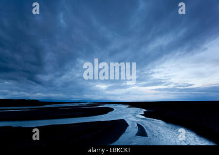 moody skies over glacial outflow river, Iceland, Skogar Stock Photo