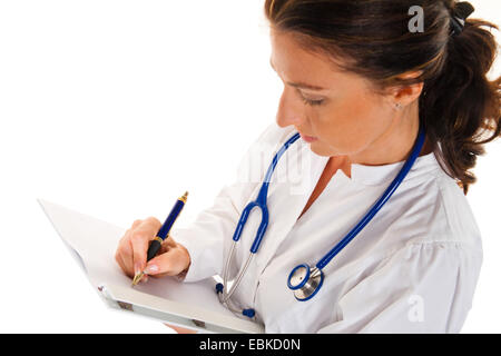 young female doctor making notes on a writing pad Stock Photo