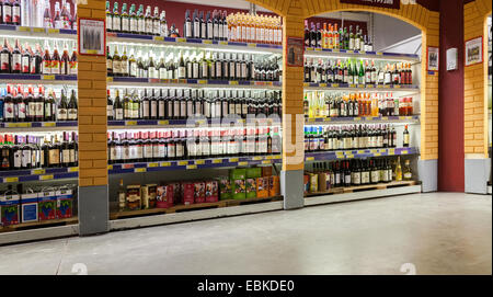 Showcase alcoholic beverages at the hypermarket METRO Stock Photo