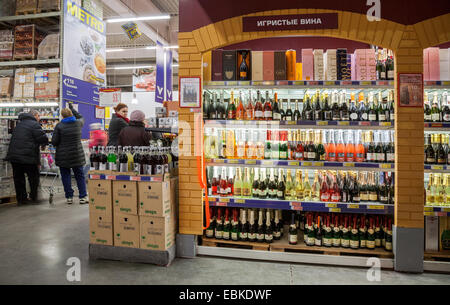 Showcase alcoholic beverages at the hypermarket METRO Stock Photo
