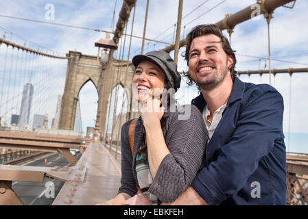 USA, New York State, New York City, Brooklyn, Happy couple on Brooklyn Bridge Stock Photo