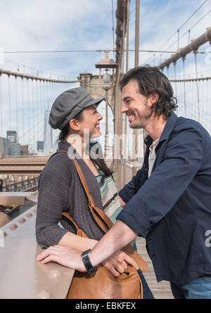 USA, New York State, New York City, Brooklyn, Happy couple on Brooklyn Bridge Stock Photo