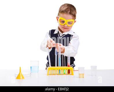 Early education. Young boy performing chemistry experiments Stock Photo