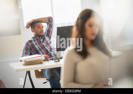 Businessman relaxing in office Stock Photo
