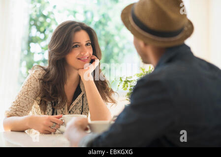 Couple sitting at table Stock Photo