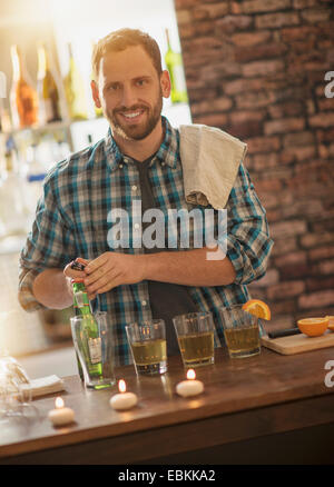 Portrait of smiling bartender Stock Photo