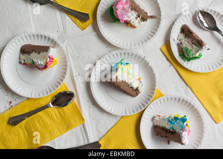 Slices of cake on plates Stock Photo