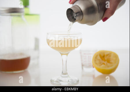 Woman pouring cocktail Stock Photo