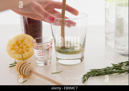 Woman making cocktail Stock Photo