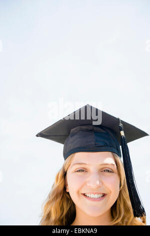 Girl (12-13) in graduation cap Stock Photo