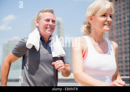 USA, New Jersey, Portrait of couple jogging in city Stock Photo