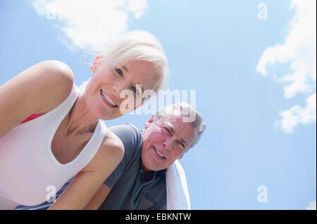 Portrait of smiling couple against sky Stock Photo