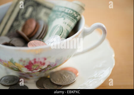 Studio shot of money in tea cup Stock Photo