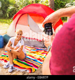 Man taking photo of woman Stock Photo