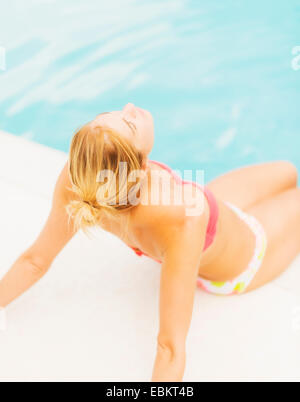 Three ladies sunbathing Stock Photo - Alamy