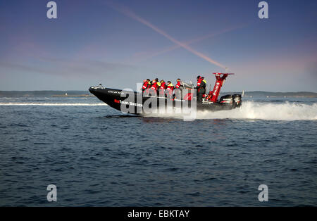 A light-weight high performance  rigid-hulled inflatable boat, (RHIB) or rigid-inflatable boat (RIB) in optimal speed 50kn (50 n Stock Photo