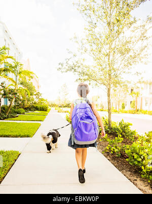 USA, Florida, Jupiter, Girl (6-7) walking her dog Stock Photo