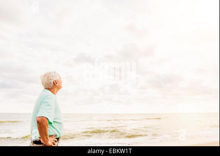 USA, Florida, Jupiter, Side view of senior man standing on beach Stock Photo