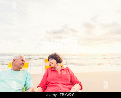 USA, Florida, Jupiter, Older couple relaxing on beach Stock Photo