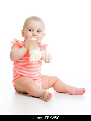 baby eating food from milk bottle Stock Photo