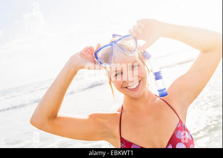 USA, Florida, Jupiter, Portrait of smiling young woman wearing scuba mask and snorkel Stock Photo