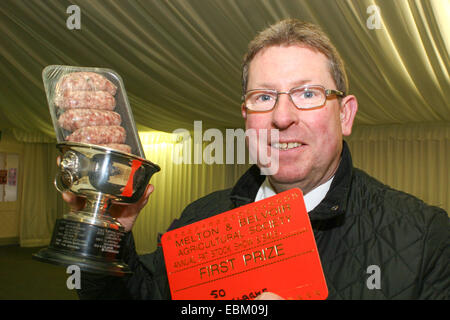 Melton Mowbray, Leicestershire, UK. 2nd Dec 2014. Ian Clarke from Queniborough in Leicestershire, UK., was the winner of Class 50, Speciality No Pork Sausages, with his lamb and leek sausages at the Annual Melton Mowbray and Belvoir Fatstock Show Credit:  Jim Harrison/Alamy Live News Stock Photo