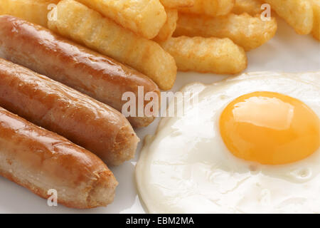 Sausage fried egg and chips a popular cafe menu item Stock Photo