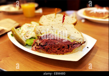 Manhattan New York USA  - Pastrami on rye bread sandwich with pickles at a New York Diner or Deli Stock Photo