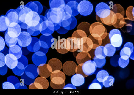 Abstract background of blue and brown circles on black stand. Stock Photo