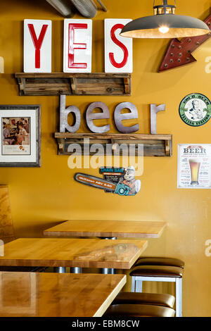 'YES Beer' sign and tables, Il Vicino Brewing Company, Albuquerque, New Mexico USA Stock Photo