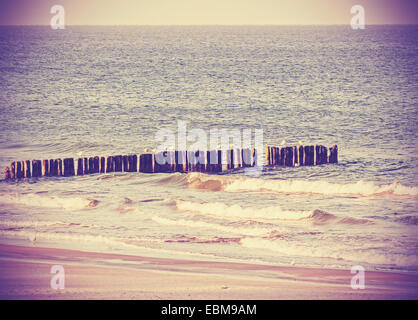 Vintage retro filtered picture of a beach, peaceful background. Stock Photo
