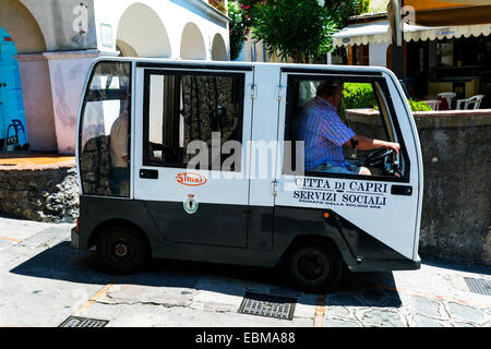 Municipal transport using tiny vehicles to negotiate some of the narrow lanes and alleys on the island of Capri. Stock Photo