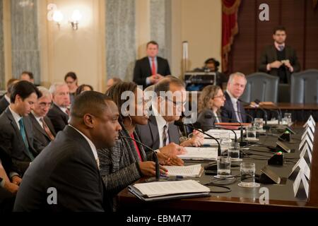 Professional sports executives (L to R) National Football League's Troy Vincent, NFLPA's Teri Patterson, Major League Baseball Joe Torre, Major League Baseball Players Association Virginia Seitz, the National Basketball Association's Kathleen Behrens, NBA Players Association Michele Roberts, National Hockey League's Jessica Berman and NHL Players' Association Steve Fehr testifies during a US Senate Commerce Committee hearing about domestic violence in professional sports December 2, 2014 in Washington, DC. Stock Photo