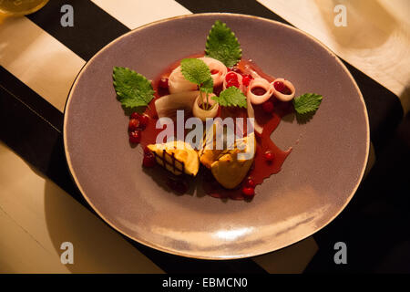 Krakow, Poland; Polish food - grilled oscypek with cranberry starter, smoked cheese made of salted sheep milk in Tatra mountains Stock Photo