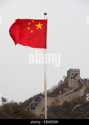 Chinese flag in front of The Great Wall of China Stock Photo