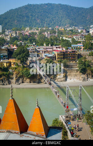 Laxman Jhula bridge over Ganges river in Rishikesh, India Stock Photo